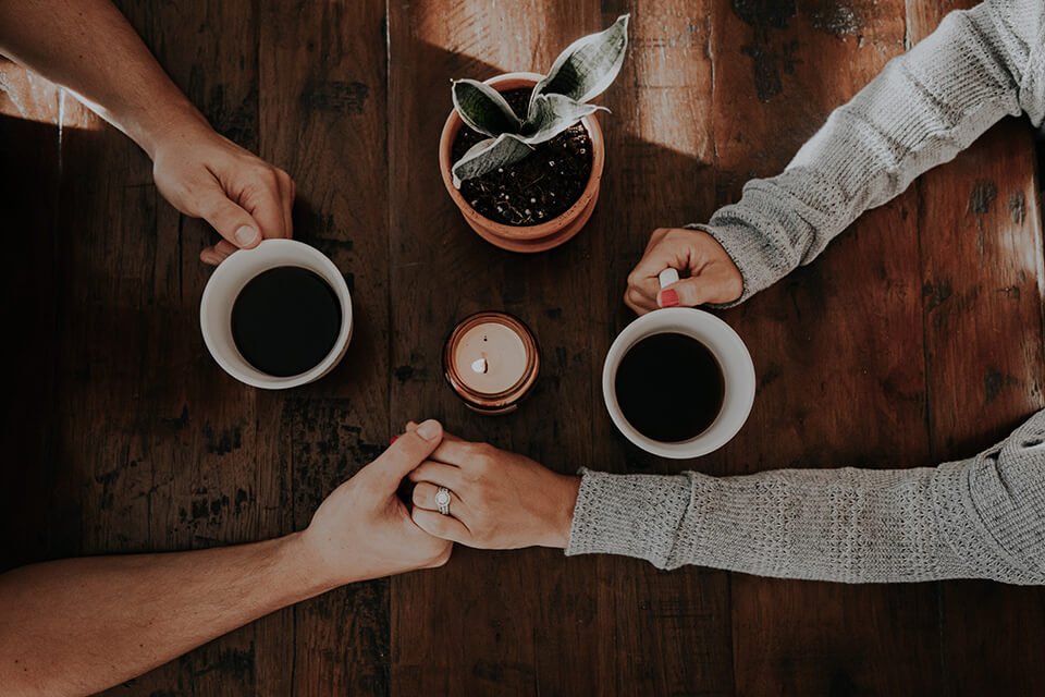 Two friends having a coffee together