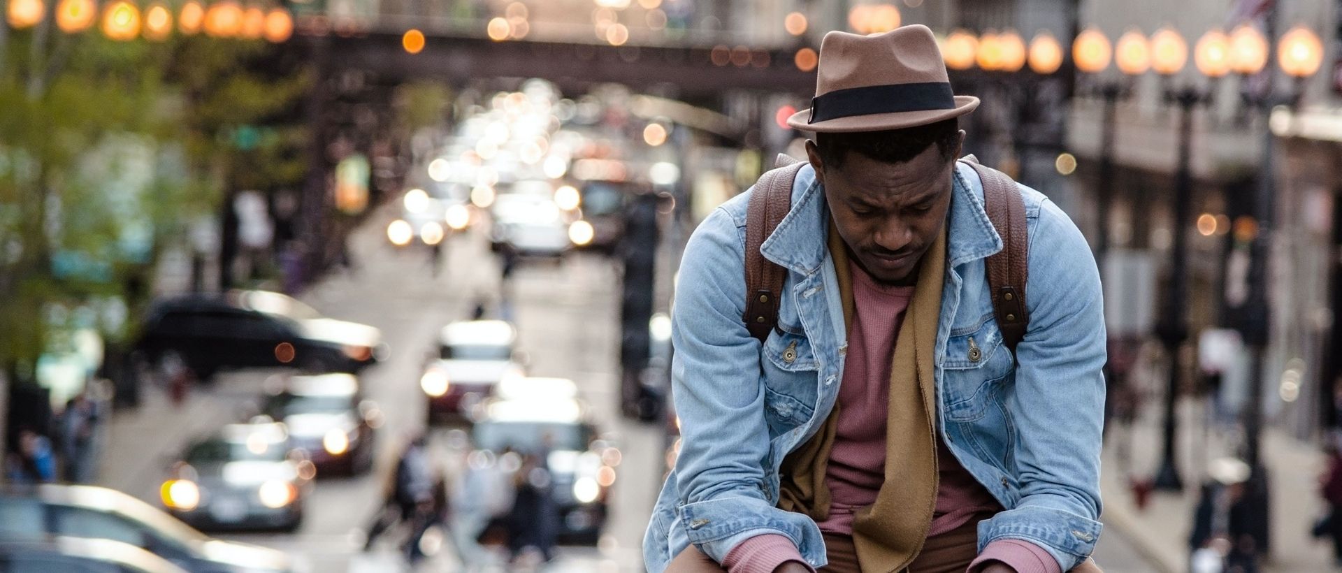 a man riding a skateboard down a city street.