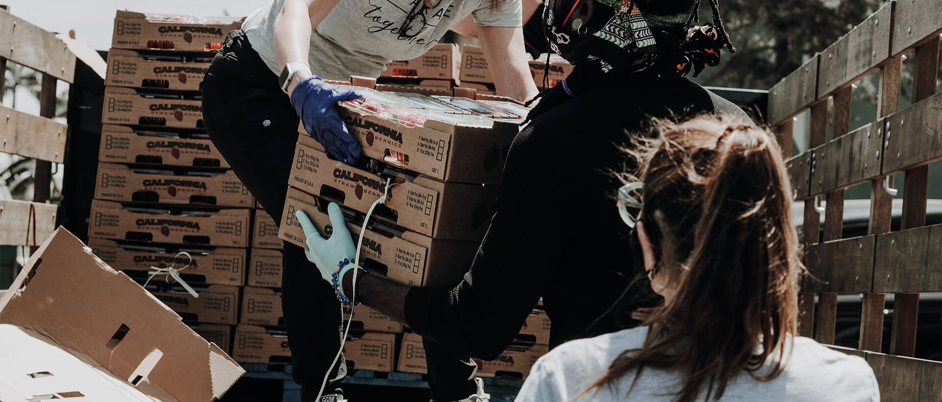 a man riding on the back of a wooden box.