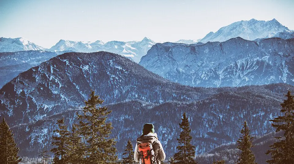 Man looking at a mountain landscape