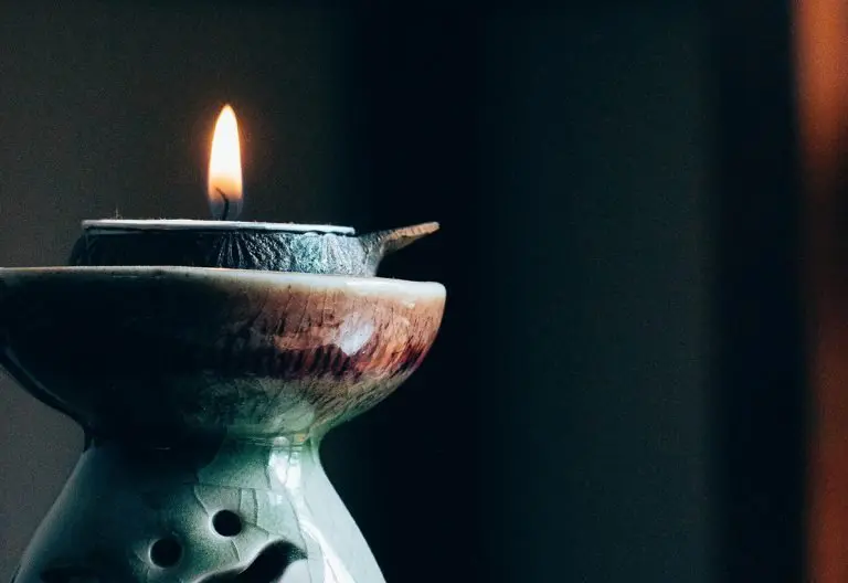 a candle that is sitting on a table.