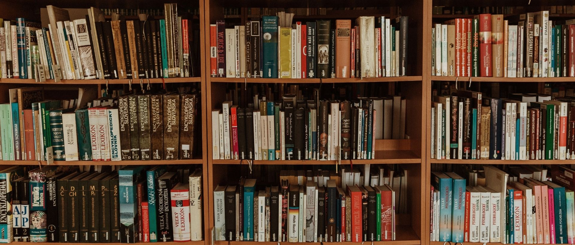 a book shelf filled with lots of books.