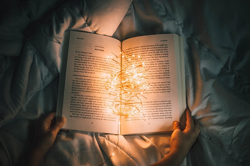 Relaxing at night with a good book to stop overthinking