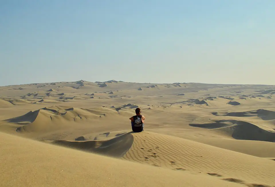 Man sitting alone in the desert