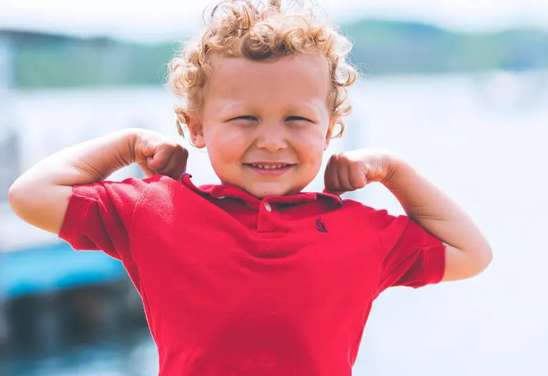 a little boy that is posing for a picture.