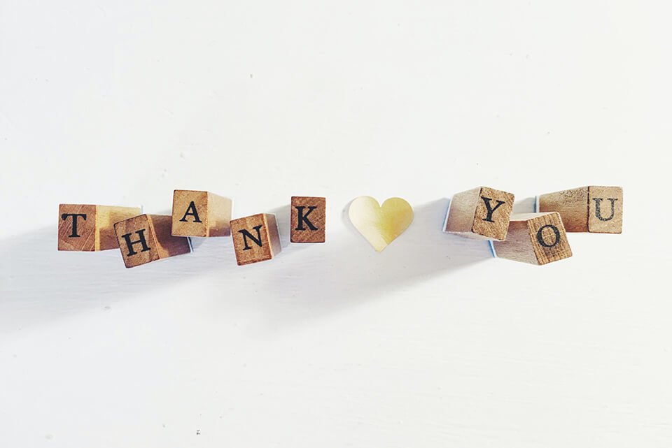 Letter blocks arranged to spell out "thank you"