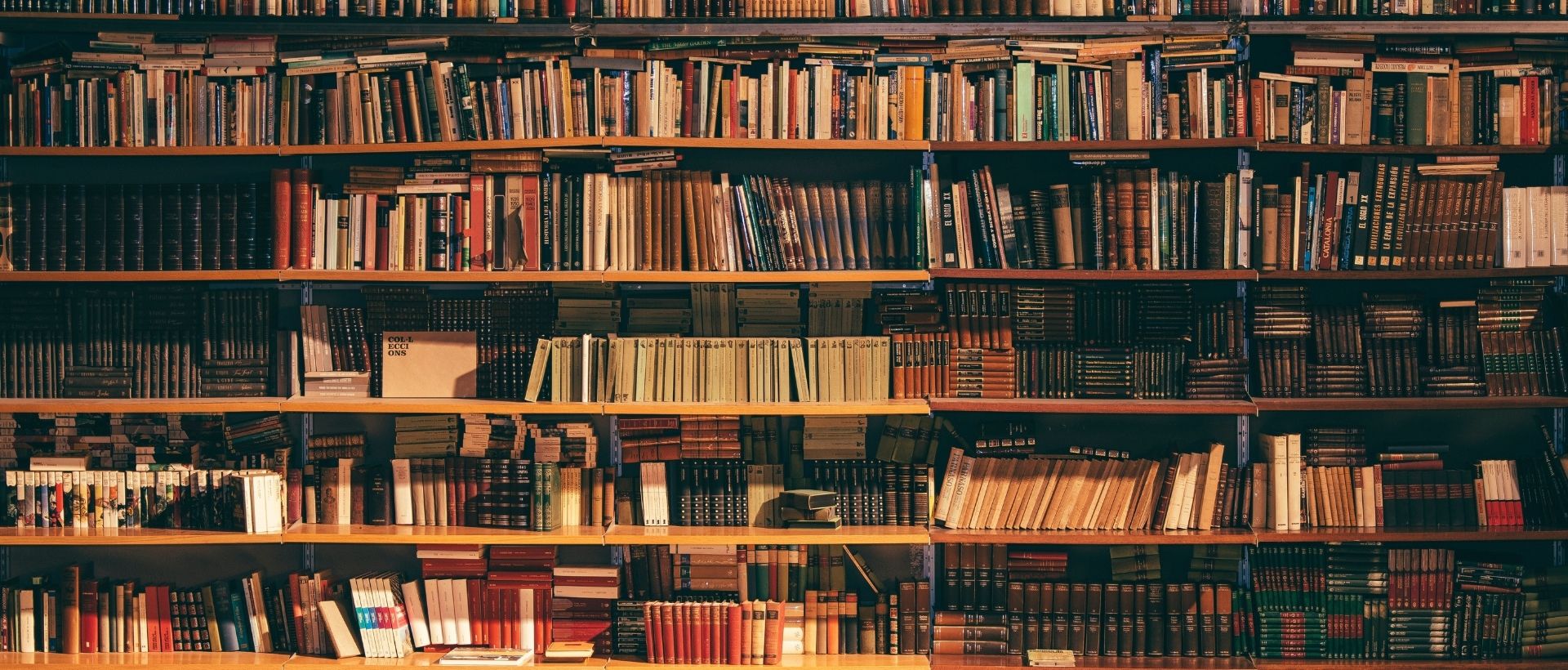 a book shelf filled with lots of books.