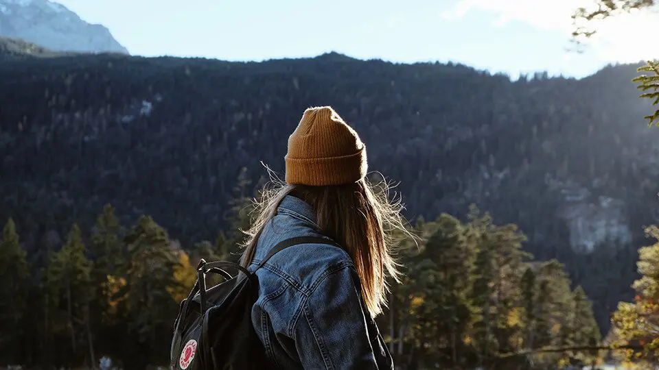 Woman hiking and lost in thought