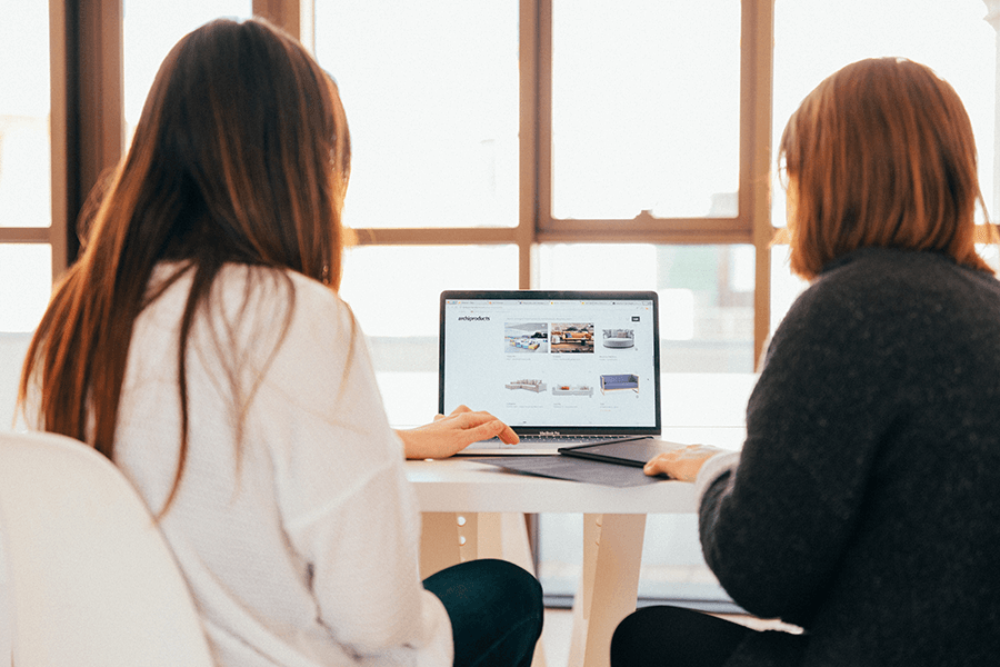 two workers sitting in front of computer